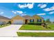 Charming single-Gathering home boasts a well-manicured lawn, two-car garage, and inviting curb appeal at 7501 Mikasa Dr, Punta Gorda, FL 33950