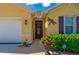 Close-up of the home's facade showcasing an inviting entryway with decorative elements at 7501 Mikasa Dr, Punta Gorda, FL 33950