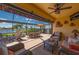 Expansive lanai flows into a screened patio, overlooking the lake, offering ideal spots for dining and relaxing at 7501 Mikasa Dr, Punta Gorda, FL 33950