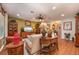 Open-concept living room with hardwood floors, comfortable seating and tasteful decor at 7501 Mikasa Dr, Punta Gorda, FL 33950