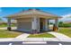 Mailbox station in a well-maintained neighborhood featuring secure mailboxes and lush green landscaping at 7501 Mikasa Dr, Punta Gorda, FL 33950