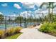 Outdoor pickleball courts offer residents a fun recreational activity in a landscaped setting under a sunny sky at 7501 Mikasa Dr, Punta Gorda, FL 33950