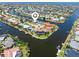 Aerial view of waterfront homes with private docks and canal access at 931 Cimarron Dr, Punta Gorda, FL 33950