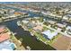 Stunning aerial view of waterfront homes with canal access and boat docks at 931 Cimarron Dr, Punta Gorda, FL 33950