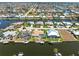 Breathtaking aerial view showcasing homes along waterfront canals at 931 Cimarron Dr, Punta Gorda, FL 33950