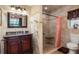 This bathroom features stylish tile floors, a sink with vanity, and a shower stall with a seat at 931 Cimarron Dr, Punta Gorda, FL 33950