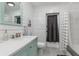 This bathroom has dual sinks with modern fixtures and a tiled shower at 931 Cimarron Dr, Punta Gorda, FL 33950