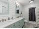 This bathroom features stylish dual sinks, modern fixtures, and a shower at 931 Cimarron Dr, Punta Gorda, FL 33950