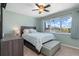 This bedroom features a large window that offers a view of the outdoors at 931 Cimarron Dr, Punta Gorda, FL 33950
