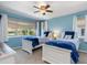 This is a bedroom with two beds and blue accent colors at 931 Cimarron Dr, Punta Gorda, FL 33950