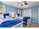 This is a bedroom with two beds, light blue walls, and a view outside at 931 Cimarron Dr, Punta Gorda, FL 33950