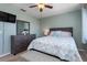 This bedroom has a large dresser, a queen bed, and a beachy color scheme at 931 Cimarron Dr, Punta Gorda, FL 33950