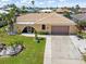 Well-maintained single-story home featuring a tile roof and a two-car garage at 931 Cimarron Dr, Punta Gorda, FL 33950