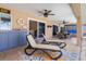 Relaxing covered lanai with ceiling fans, lounge chairs, wet bar, and outdoor seating area at 931 Cimarron Dr, Punta Gorda, FL 33950