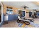Outdoor covered seating area with a tiki bar, perfect for relaxation and entertainment by the pool at 931 Cimarron Dr, Punta Gorda, FL 33950