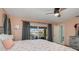 This spacious bedroom has sliding doors that lead to a lanai overlooking the pool and canal at 931 Cimarron Dr, Punta Gorda, FL 33950