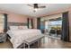 The main bedroom has patio access, tile floors, and neutral colors at 931 Cimarron Dr, Punta Gorda, FL 33950