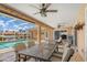 Covered patio featuring a dining table, ceiling fans, and a view of the pool at 931 Cimarron Dr, Punta Gorda, FL 33950
