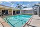 Inviting screened-in pool with sparkling water and a spacious deck with lounge chairs, perfect for entertaining at 931 Cimarron Dr, Punta Gorda, FL 33950