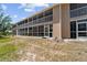 Screened-in patio of this condo offers outdoor living space with lush landscaping and beautiful views at 9850 Fiddlers Green Cir # 130, Rotonda West, FL 33947