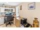 Home office featuring a built-in desk, ample storage, and a comfortable workspace at 9850 Fiddlers Green Cir # 130, Rotonda West, FL 33947