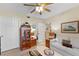 Warm, inviting living room featuring tile floors, a ceiling fan, and comfortable sofa at 9850 Fiddlers Green Cir # 130, Rotonda West, FL 33947
