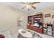 Inviting living room showcasing a ceiling fan, a window, and comfortable seating area at 9850 Fiddlers Green Cir # 130, Rotonda West, FL 33947