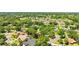 Established neighborhood featuring a mix of mature trees, single-Gathering homes, and well-maintained lawns at 1102 Hunt Club Ln, Valrico, FL 33594