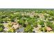 Established neighborhood featuring a mix of mature trees, single-Gathering homes, and well-maintained lawns at 1102 Hunt Club Ln, Valrico, FL 33594