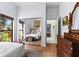 Bright, spacious bedroom with natural light, featuring a mirrored closet and wood floors at 1102 Hunt Club Ln, Valrico, FL 33594