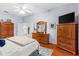 Bedroom with plenty of wooden furniture and ensuite at 1102 Hunt Club Ln, Valrico, FL 33594