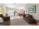 Open living space with tile flooring flowing into a dining area with hardwood floors, creating an inviting atmosphere at 1102 Hunt Club Ln, Valrico, FL 33594