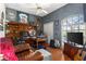 Well-appointed home office featuring a large desk, shelving, and ample natural light, perfect for productivity at 1102 Hunt Club Ln, Valrico, FL 33594