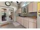 Well-equipped outdoor kitchen with stainless steel grill and countertop space at 1102 Hunt Club Ln, Valrico, FL 33594