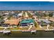 Gorgeous aerial view of a waterfront property showcasing a screened-in pool and private boat dock at 1134 Coronado Dr, Punta Gorda, FL 33950