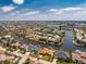 Aerial view of a waterfront home with canal access in a residential community at 1134 Coronado Dr, Punta Gorda, FL 33950