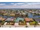Aerial view of a single-Gathering home with a green roof and well-maintained landscaping at 1134 Coronado Dr, Punta Gorda, FL 33950
