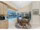 Cozy dining area featuring a bay window with a pool view at 1134 Coronado Dr, Punta Gorda, FL 33950