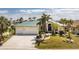 Charming single-Gathering home with lush landscaping, a spacious driveway, and a two-car garage at 1134 Coronado Dr, Punta Gorda, FL 33950
