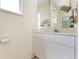 Bright half bathroom featuring a vanity with a mirror, essential fixtures, and neutral decor for a clean, minimalist aesthetic at 1134 Coronado Dr, Punta Gorda, FL 33950