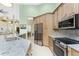 Eat-in kitchen featuring stainless steel appliances, light wood cabinetry and stone countertops at 1134 Coronado Dr, Punta Gorda, FL 33950