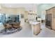 Bright kitchen with granite countertops, stainless steel appliances, and an adjacent breakfast nook with seating at 1134 Coronado Dr, Punta Gorda, FL 33950