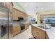Spacious kitchen with stainless steel appliances, granite countertops, ample cabinet space, and a view of the pool at 1134 Coronado Dr, Punta Gorda, FL 33950