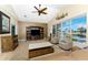 Living room with comfortable seating, expansive windows with water views, vaulted ceilings and a decorative color wall at 1134 Coronado Dr, Punta Gorda, FL 33950