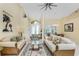 Bright, spacious living room featuring neutral colors, a glass coffee table, and views to the dining area at 1134 Coronado Dr, Punta Gorda, FL 33950