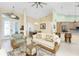 Bright living room open to dining area and kitchen, featuring neutral decor and lots of natural light at 1134 Coronado Dr, Punta Gorda, FL 33950
