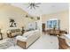 Open-concept living room with tile floors, neutral furniture, and lots of natural light at 1134 Coronado Dr, Punta Gorda, FL 33950