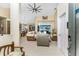 Open-concept living room with comfortable seating, access to the pool area, and views of the kitchen at 1134 Coronado Dr, Punta Gorda, FL 33950