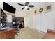 Bright home office with large closet, ceiling fan, desk with a hutch, and walls adorned with decor at 1134 Coronado Dr, Punta Gorda, FL 33950