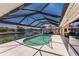 Enjoy the swimming pool inside of a screened enclosure with waterfront views at 1134 Coronado Dr, Punta Gorda, FL 33950